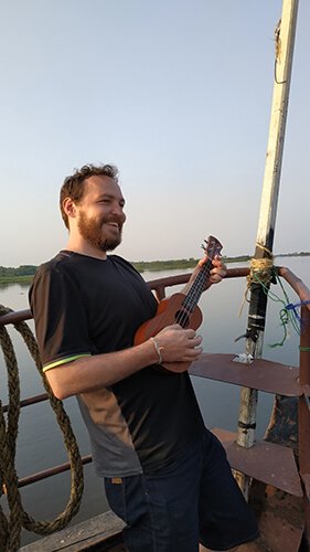 Playing ukulele on the boat